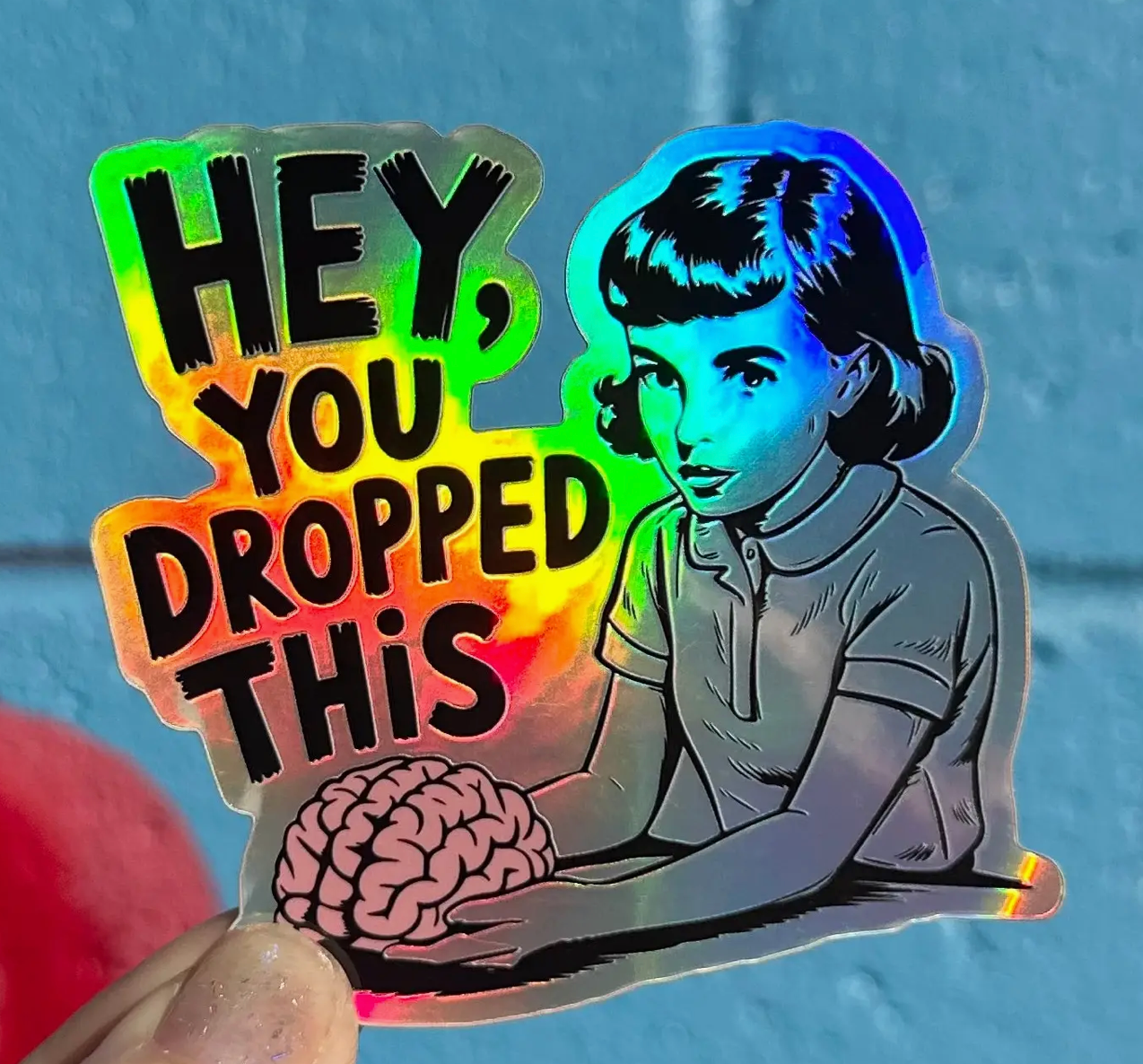 Hilarious Humanitarian- Hey, You Dropped This Holographic Sticker